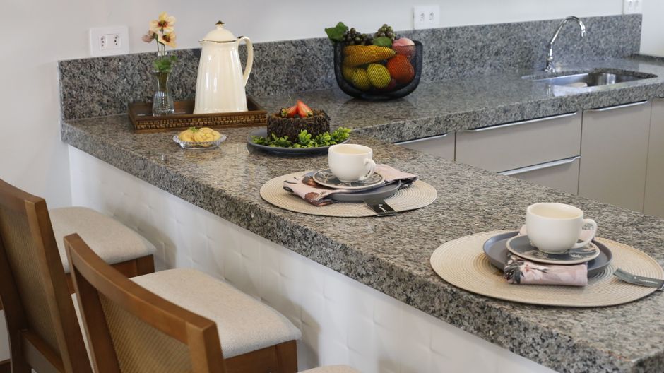 Kitchen countertop with a few items set on the surface.